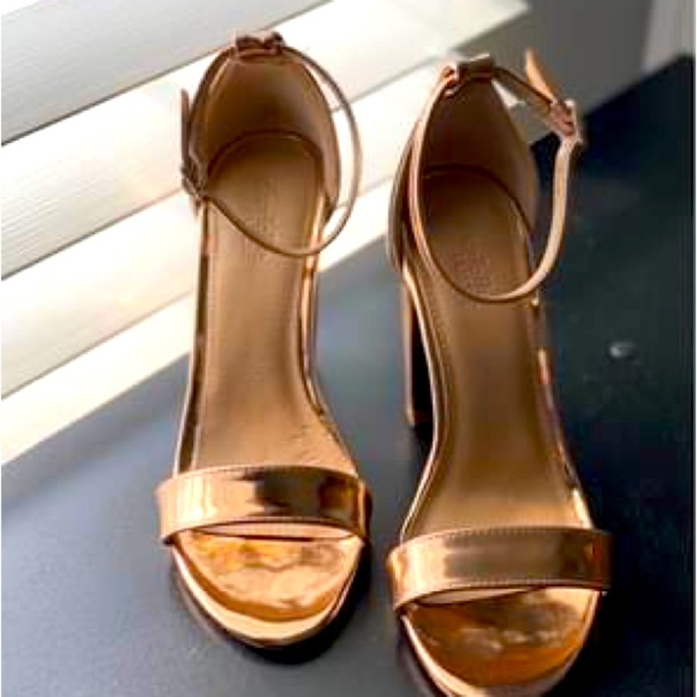 Selling my Shiny Rose Gold Heels. Worn only a few times.They are size 7